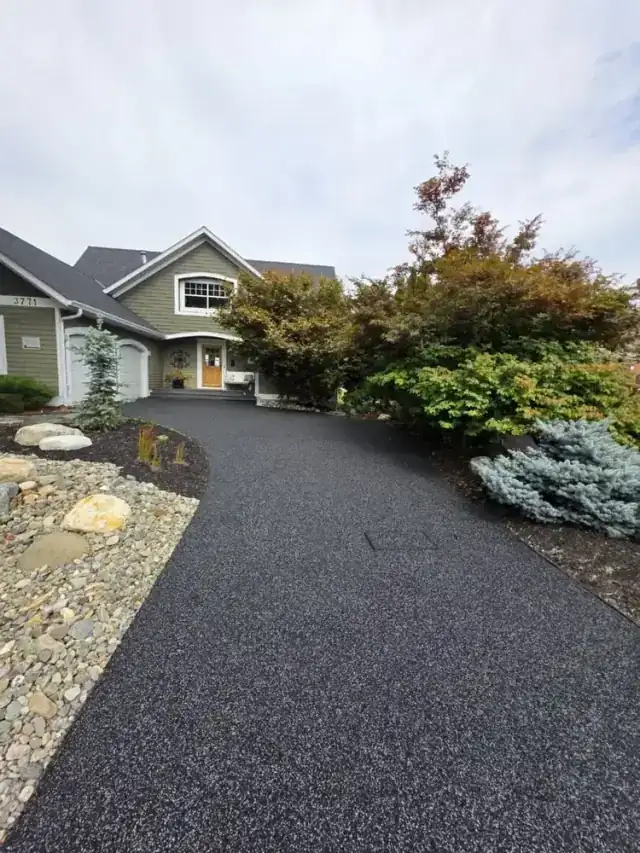 Beautiful brown rubber paving driveway in front of a Canadian home