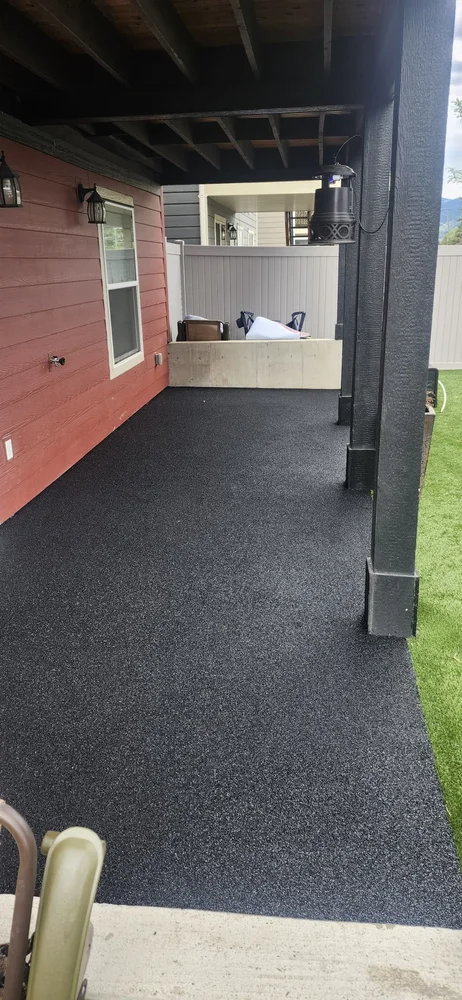Black rubber covered patio surface