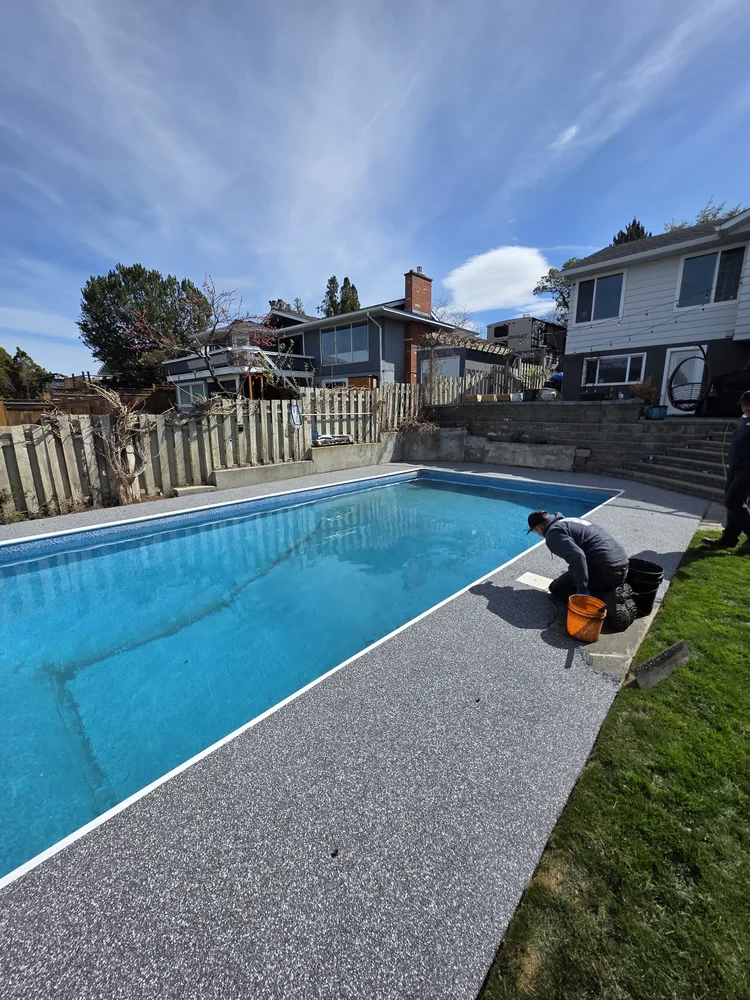 Rubber pool deck around inground pool